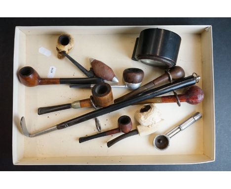 A small collection of smoking pipes to include Meerschaum examples together with a ebony cased clock. 
