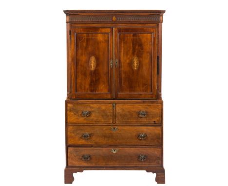 A Georgian mahogany and inlaid gentleman's wardrobe:, bordered with boxwood lines, the upper part with a moulded dentil corni