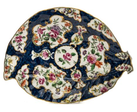 A First Period Worcester porcelain leaf shaped dish: decorated in coloured enamels with garden blooms within gilded borders r