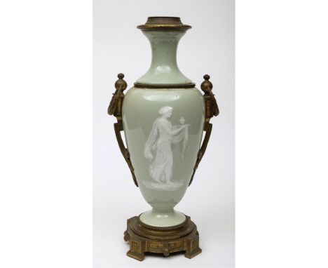A 19th Century pate-sur-pate and ormolu mounted table lamp: of slender tapering form, decorated with a neo-classical female, 