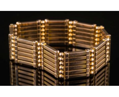 A late 19th / early 20th century gold gate-link bracelet of expanding flexible linking:.