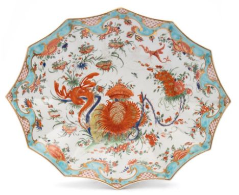 A First Period Worcester 'Jabberwocky' pattern dish: of fluted oval form, painted with a dragon, a banded hedge, flowers and 