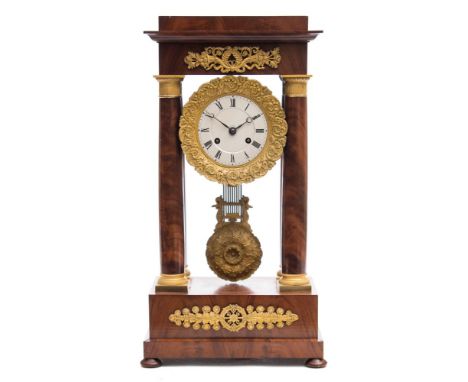 Dupont à Paris, a walnut portico clock: the eight-day duration movement striking the hours and half-hours on a bell with an o