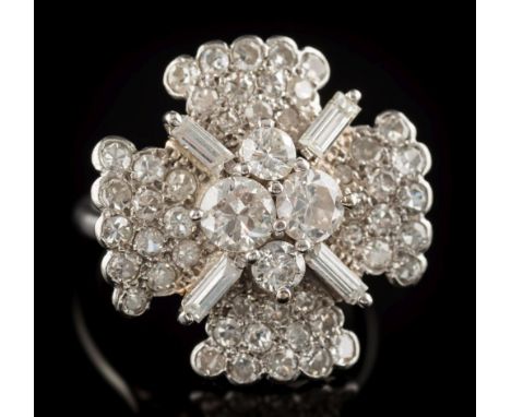 A diamond mounted quatrefoil cocktail cluster ring: pave-set with single-cut diamonds, the central cluster comprising two Eur