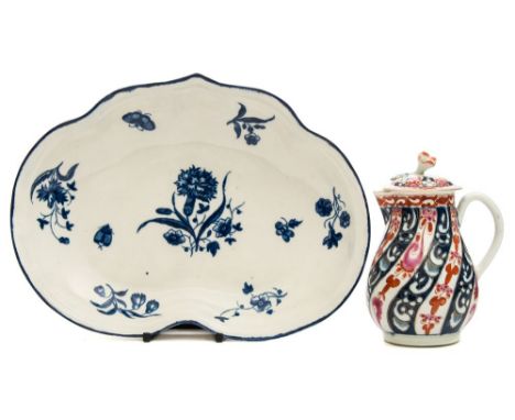 A First Period Worcester porcelain dish and cream jug and cover: the former of shield shape printed in blue in the Gilliflowe