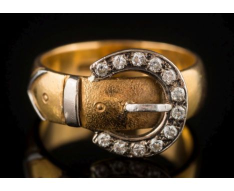 A 22ct gold and diamond-set 'buckle' ring: set with circular, brilliant-cut diamonds, 8.5gms gross weight, ring size N 1/2. 