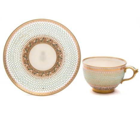 A Royal Worcester porcelain cup and saucer attributed to George Owen: of finely reticulated form around a white and turquoise