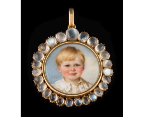 A gold and graduated moonstone circular miniature portrait pendant: depicting Walter. F. Young, head and shoulders as a boy, 