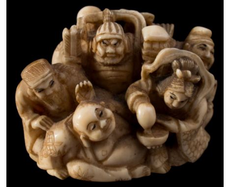 A Japanese carved ivory netsuke, signed Shugyoku: depicting a group of figures from Japanese and Chinese mythology, including