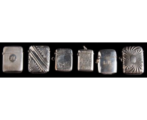 A Victorian silver vesta case, maker WH, London, 1895: initialled, with engine turned decoration, together with five other si