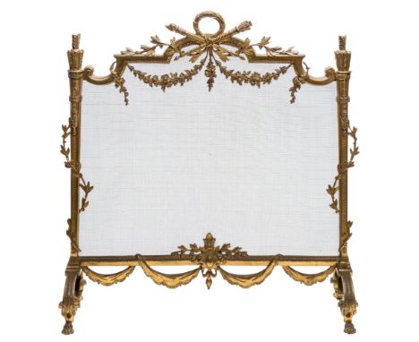A French gilt brass fire screen:, surmounted by a laurel leaf garland, torch and quiver of arrows and foliate stems and swags