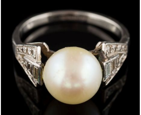 An Art Deco platinum, 'pearl' and diamond ring: the single 'pearl' approximately 9.3mm diameter, between tapering shoulders o