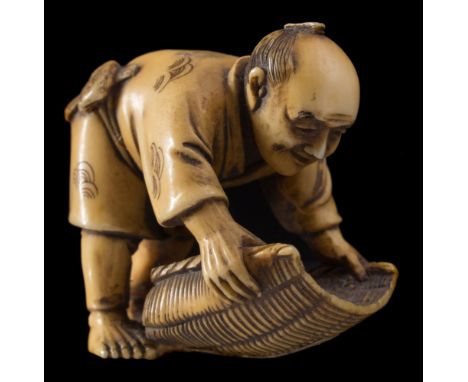 A Japanese carved ivory netsuke, signed Mitsuyuki: of a smiling man moving a large sieve, Meiji, 3 cm high.