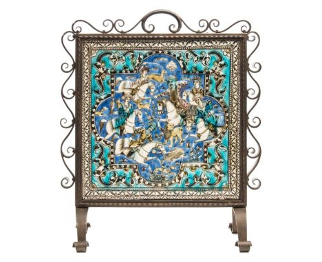 A Persian Qajar polychrome moulded pottery tile panel: depicting a hunting scene with a small inscription above, all within a