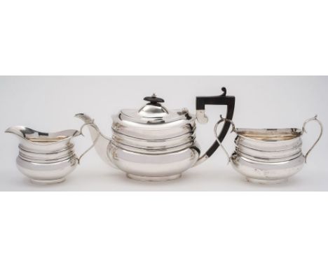 An Edward VII silver  three-piece tea service, maker Frank Cobb & Co Ltd, Sheffield, 1904/5: of plain barge-shaped outline wi