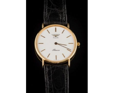 Longines. A gentleman's 9ct gold 'Longines Quartz Presence' wristwatch: the circular white dial 39mm diameter with baton mark