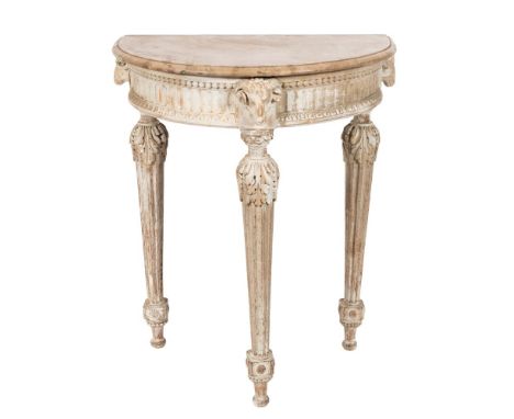 A carved and decorated pine half round console table:, with a faux marble top, the fluted, beaded and foliate decorated friez