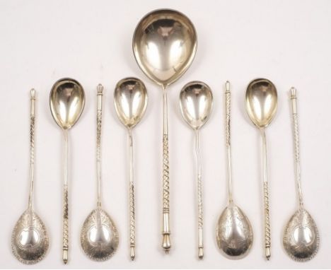 A matched set of eight Imperial Russian silver spoons and a serving spoon, assay masters A.A, Moscow 1891 and A.P, Moscow, 18