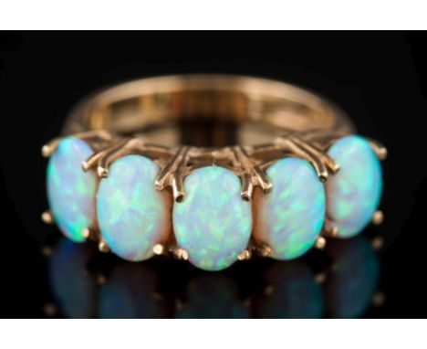 A 9ct gold and opal five-stone ring: each opal approximately 7mm long, 3.3gms gross weight, ring size M 1/2.  