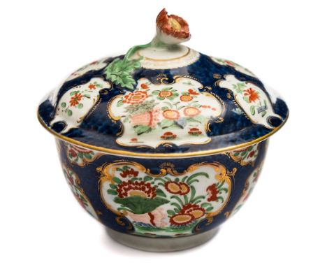 A First Period Worcester blue scale sucrier and cover: with flower finial, painted in the kakiemon palette with flowers and f