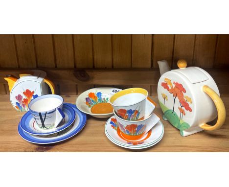 A Clarice Cliff fruit dish with reproduction Clarice Cliff items.