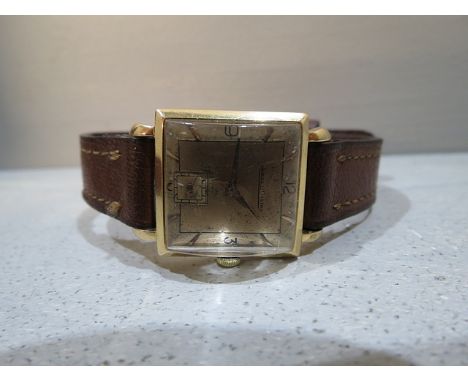 A 1940s Jaeger Lecoultre 18ct rose gold wrist watch having fancy lugs and offset seconds