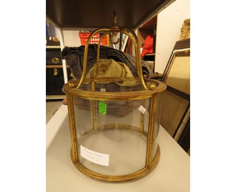 A 20th century gilt metal and glass hall lantern of circular form with four glass panels