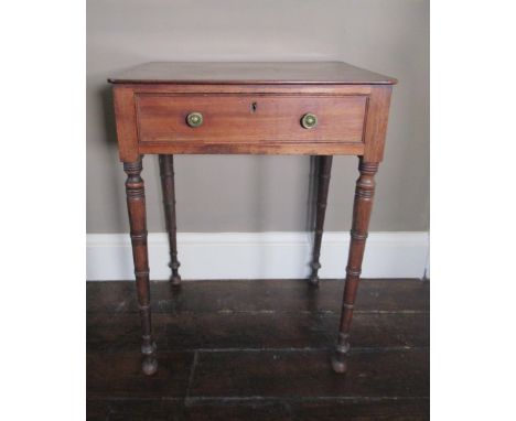 Regency mahogany side table, the rounded rectangular top above a cockbeaded drawer with brass drum handles on ring turned tap