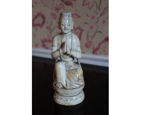 C17th/18th Chinese ivory model of an Acolyte, carved in royal pose with hands in anjali mudra on ruyi base, H21cm 