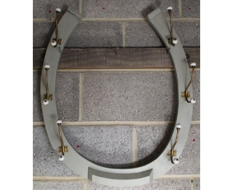 Horseshoe shaped painted vintage coat rack, six double brass hooks with ceramic ball finials, H70cm W63cm 