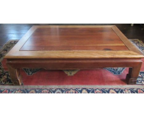 Chinese hardwood coffee table, rectangular top with shaped frieze on Greek Key carved supports, W114cm D77cm H33cm 