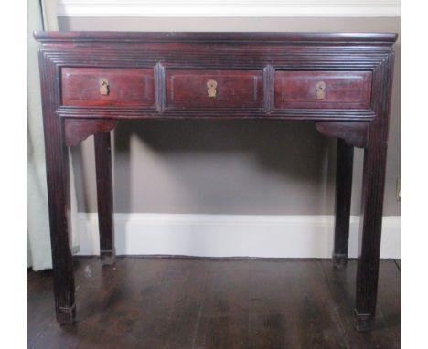Chinese hardwood rectangular side table, the reeded frieze with three drawers on reeded and Greek Key carved supports, W94cm 