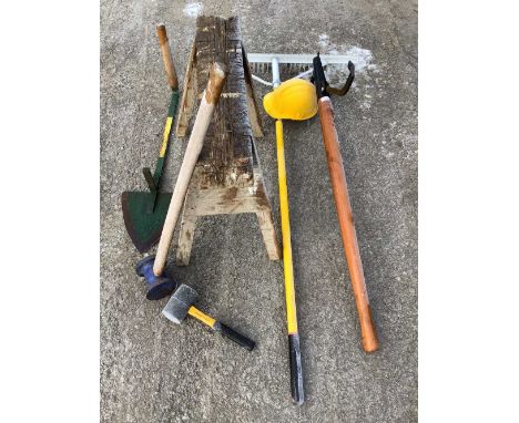 Set of tools related to timber work including log lifter, large aluminium rake, fencing mallet, small mallet, saw horse, safe