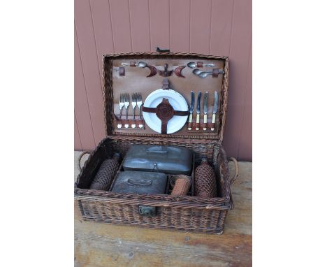 Drews' &amp; Sons Drews' Own Make picnic basket containing two tin boxes with enamel liners, two wicker bound glass bottles, 