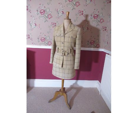 Tailors female mannequin, fabric body painted E.G.46 on slender column support and three cabriole legs fitted with Charlotte 