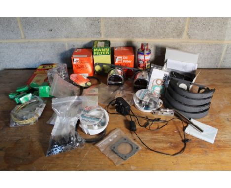 Collection of car part for various cars, including chrome rear lights, Lucas bulbs, oil filters, gaskets, timing belts, rear 