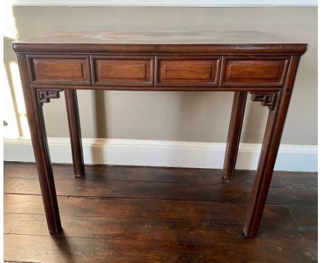 Chinese hardwood rectangular side table with four fielded panel frieze on square moulded supports with fret carved corner ang
