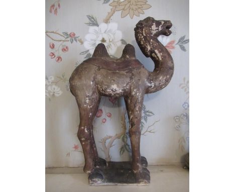 Tang style painted terracotta model of a standing camel, brown painted, H43cm 