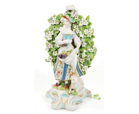 A Derby patch marked candlestick figure, of a shepherdess with lamb at her feet, set of a rococo base, c.1775, (sconce missin