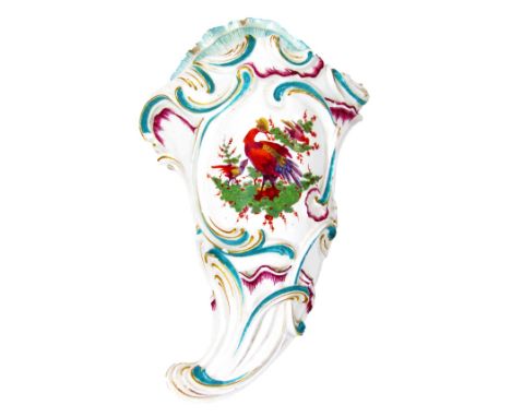 A Derby cornucopia wall pocket, of rococo shape, decorated with exotic birds, c.1765 (patch mark) 25cm x 14cm. (AF) NB. For a