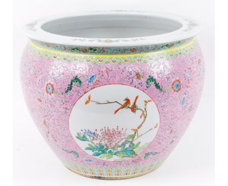 A Chinese late Qing period fish bowl, of large proportion, famille rose decorated with panels of birds on flowering branches 