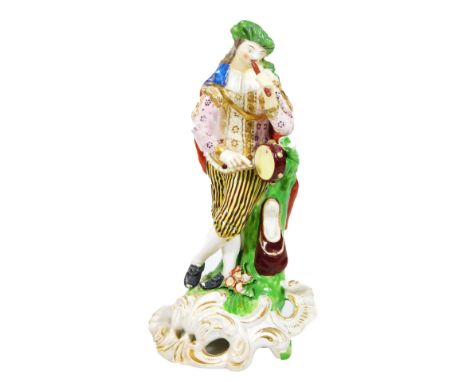 A Derby figure of a musician, playing a pipe and drum on a rococo base, c.1835, incised mark no.311, overall 21cm high.