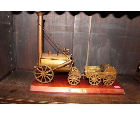 Brass model of Stephenson's Rocket mounted on wooden base 