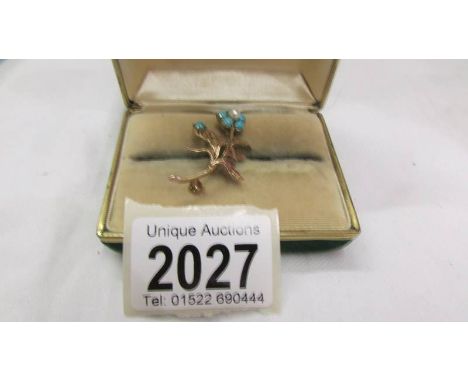 A sweetheart brooch fashioned as a forget me not flower in turquoise and pearl set 9ct gold.