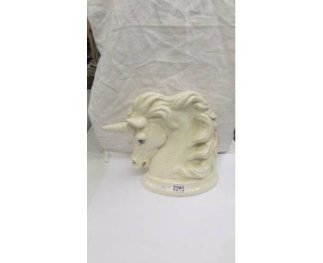 A Kruger sculpture, hand made in Cornwall Unicorn, signed S T K, 26cm high.