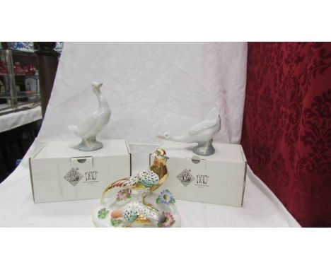 A hand painted golden pheasant group and two boxed NAO ducks.