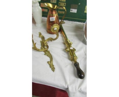 A brass garden spray, a wall light and a copper jug.