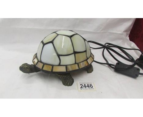 A Tiffany style "Tortoise" shaped table lamp.