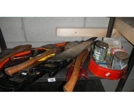 A shelf of saws, axes etc., (collect only)