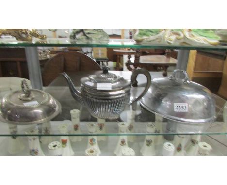 A silver plate teapot, meat cover and tureen lid.